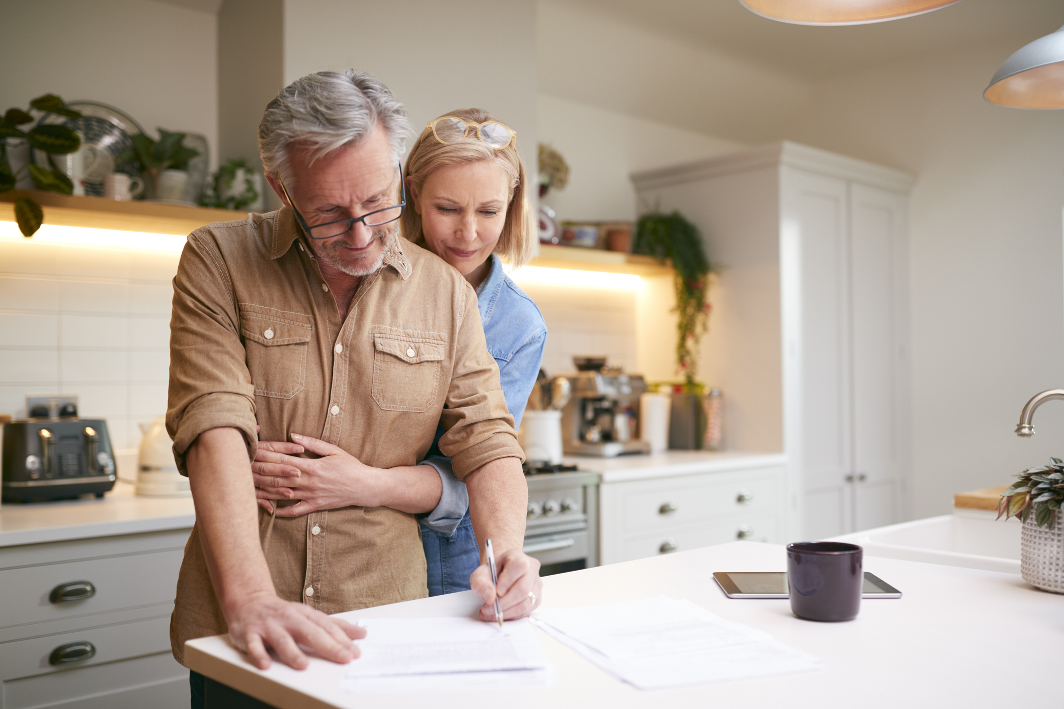 Couple reviewing their financial plan together at home
